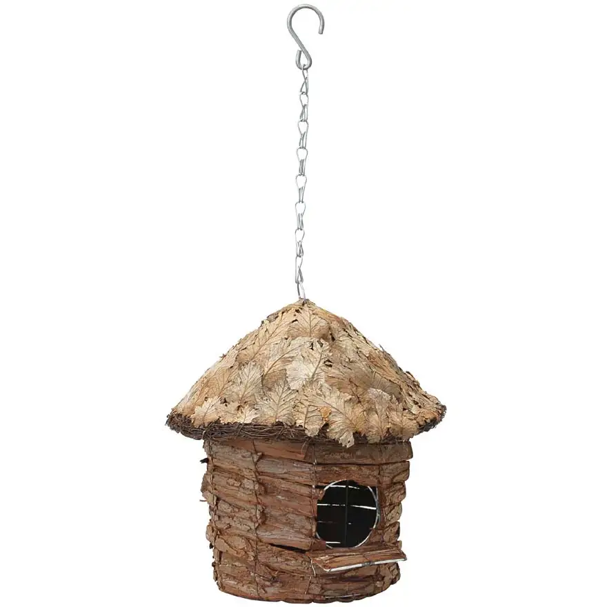 Round hut house with leaf-covered roof